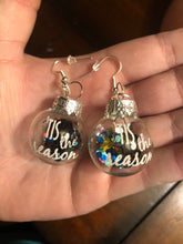 Load image into Gallery viewer, Clear/ Glittery “Tis The Season” Christmas Ornament earrings
