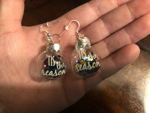 Load image into Gallery viewer, Clear/ Glittery “Tis The Season” Christmas Ornament earrings
